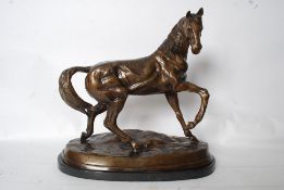 After Antoine-Louis Barye. A very large cast bronze marley horse. The prancing stallion being raised