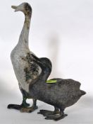 A Chinese Bronze garden duck along with another.