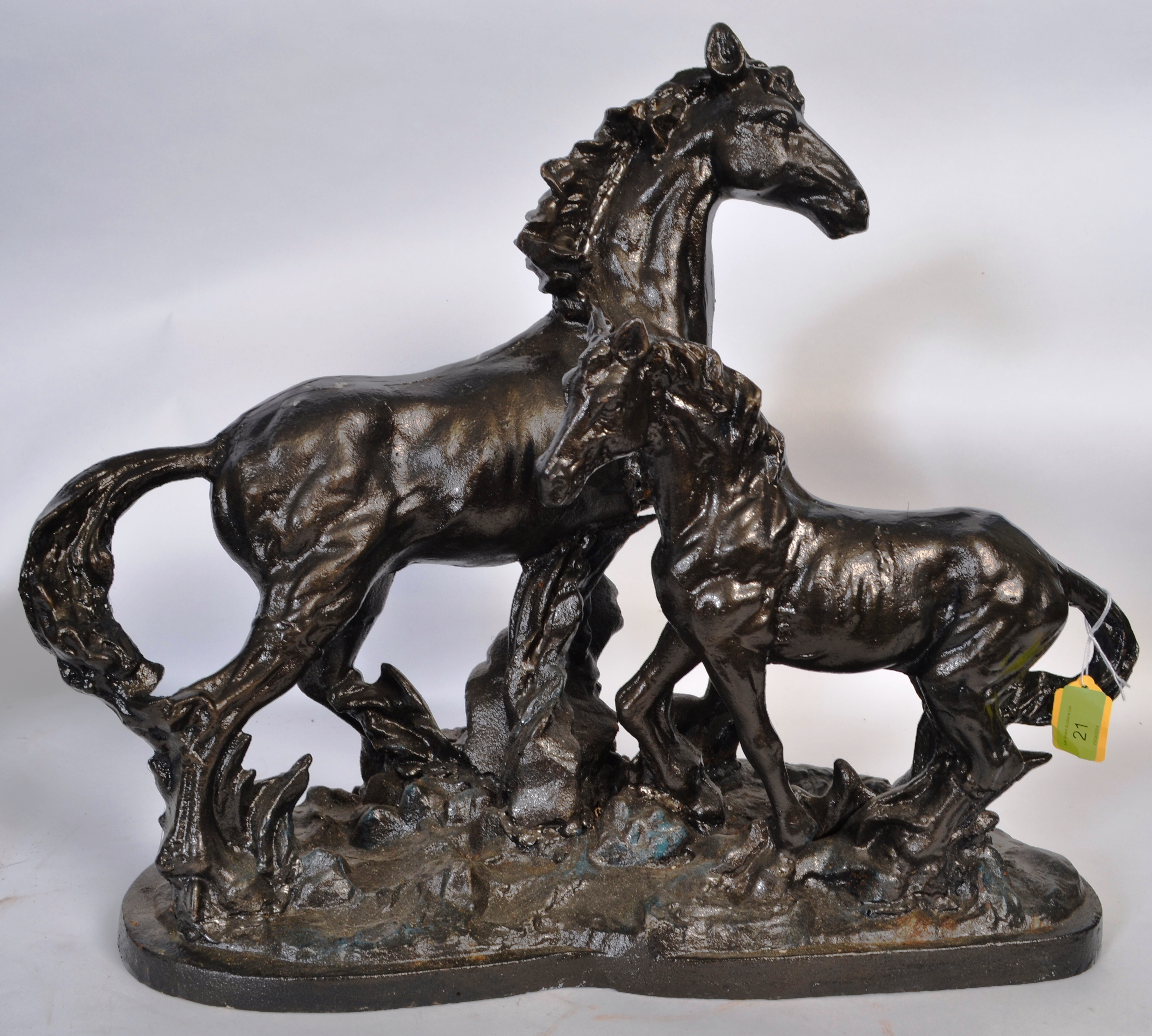 A large 20th century cast iron figural group of horses, on a large heavyweight cast iron