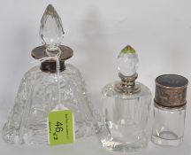 A hallmarked silver and cut glass perfume bottle together with another hallmarked silver perfume