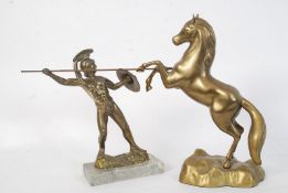 Two cast brass 20th century decorative statues, one of a fighting gladiator the other of a horse.