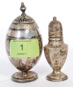 A hallmarked silver condiment shaker along with another, unmarked, white metal canister.