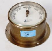 An antique H. Hughes & Son circular brass barometer, with notation to dial.
