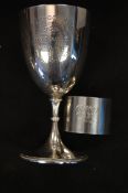 A silver hallmarked chard school hundred yards cup along with a hallmarked napkin ring. Weight