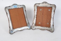 A pair of hallmarked for chester silver easel backed picture frames date letter 1906 by........