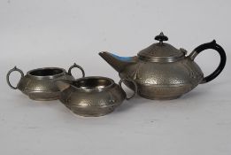 An arts and crafts pewter hammered teapot sugar bowl and creamer. Stamped pewter 3476