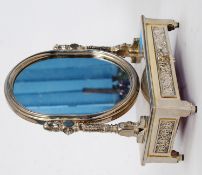A silver plate dressing mirror on a drawered base