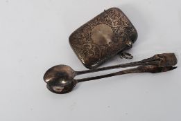 A hallmarked Silver vesta case being rococo chase decorated along with hallmarked sugar tongs.