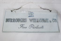 A Vintage 20th century bevelled glass shop advertising sign bearing notation for Burrough Welcome &