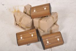 A collection of unused wooden effect 1970`s television switches. some never out of wrapping.