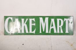 A very large late 19th century early 20th century enamel advertising sign for Cake Mart. The vivid