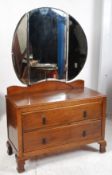 A 1930`s Art Deco oak dressing table chest of drawers. Raised on shaped legs with double drawers