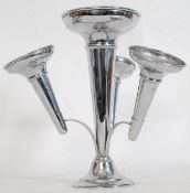 A decorative silver plated epergne being raised on terraced base with central column with 3