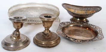A pair of hallmarked silver short candlesticks along with a quantity of silver plate and white metal