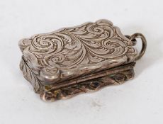 A sterling silver hallmarked vinaigrette for FM, Birmingham with chased decoration to exterior and