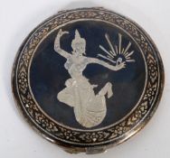 White metal compact with chased decorative figures of traditional Thai figure. Stamped silver.