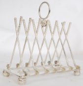 A 20th century silverplate toast / letter rack, the bars being shaped like golf clubs and the feet