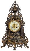 A 19th century French gilt metal cased mantel clock with Arabic numeralled ceramic dial, eight day