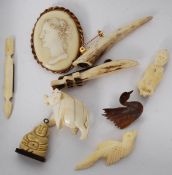 A collection of bone and ivory wares to include brooches, cameo. pendant etc ( see illustration )