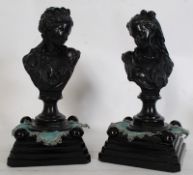 A pair of cast metal busts of continental origin being signed to the underside, illegible. Raised