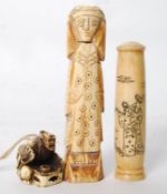 An unusual egyptian bone handle together with another and a small resin netsuke