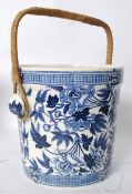 A 19th Century Wedgwood blue and white large peat bucket having rattan weave handle