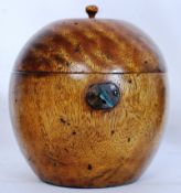 A Fruitwood tea caddy in the shape of an apple, with inset lock and hinged interior compartment.