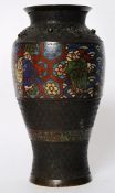 A 19th century Chinese oriental bronze vase with tiger decoration to top and enamel caramic painted