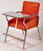 A vintage retro vinyl childs highchair in red, with laminated wood tray and footrest, all on curved