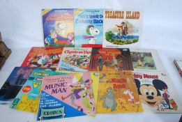 A collection of vintage childrens vinyl record LP albums including Charlie Brown, Winnie The Pooh,