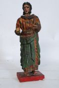A 19th century carved pine religious icon figure of Jesus Christ, with hand painted finish on a