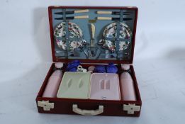 A 1950`s Brexton picnic set complete in the original box having swivel clasp  hinges lifting to