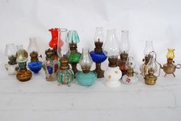 A good collection of miniature oil lamps to include many different style, Milk glass, coloured