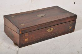 A Rosewood and brass inlaid writing slope with ivory handled interior, drawers and brass exterior