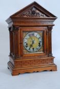 A 19th century brass faced fusee movement bracket clock, on plinth base with column supports and