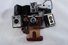 A Pentax EM SLR Camera with Nikon Lens series E and another with spare Nikon lens, Starblitz