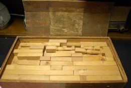 An early 20th century wooden building block game, in original box with label to lid