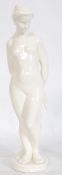 A large 20th century figurine of a nude woman in the neo classical style  being raised on a