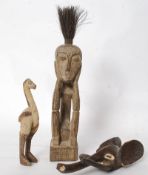 A collection of 3 carved wood tribal items including a seated hardwood figure with brush head, a