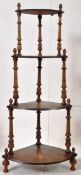 A Victorian walnut inlaid corner whatnot on turned supports with inlaid shelves. 135cm tall.