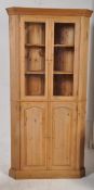 A good quality large country pine corner cabinet. Plinth base with cupboard under glazed display