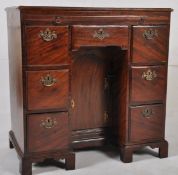 An 18th century Georgian  solid mahogany kneehole desk of small size. The rectangular top above