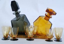 A 1930`s Art Deco two tone black and amber glass decanter set comprising a matched set of