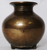 A 17th century Chinese oriental bronze censur / brush pot vase standing on three small square feet.
