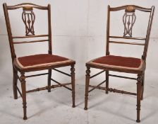 2 late Victorian mahogany marquetry inlaid bedroom chairs. Raised on turned supports united by