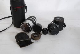 A collection of camera lenses to include Prinz Galaxy, vintage Kodak, Sun Zoom, Vivitar etc