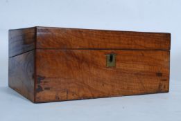 A 19th century Georgian burr walnut writing slope having handles to the sides. Opening to reveal a