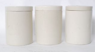 A set of 3 20th century cream glazed china kitchen jars / sweet jars all with lids being unsigned.