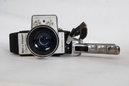 A Bell & Howell vintage 1950`s cine camera complete with case together with a splicer