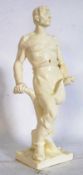 A large 20th century figurine / china sculputure of Russian origin depicting man with plough being
